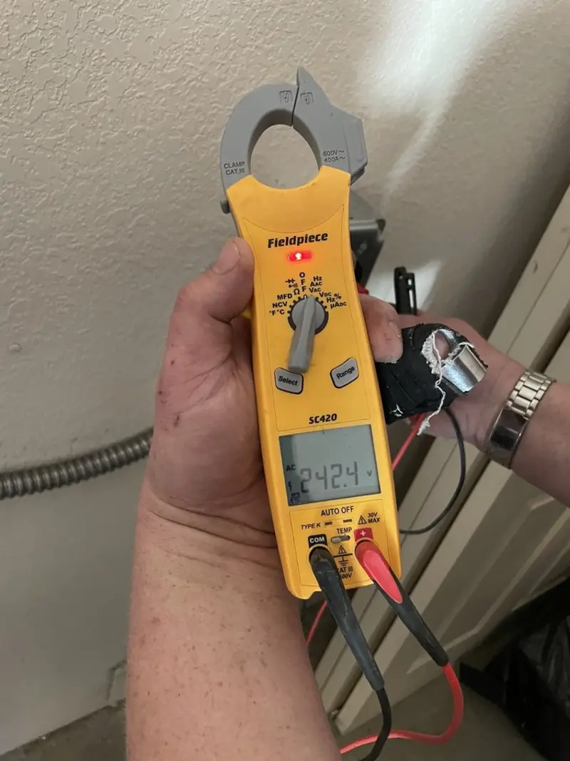 Voltage testing with clamp meter during Whole House Surge Protector in Southern Pines
